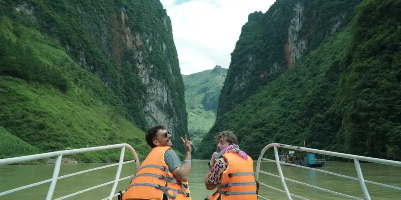 The Nho Que river running between steep canyon walls in Ha Giang, seen from a boat