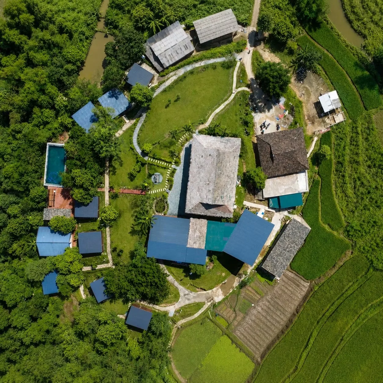 Overhead view of the Jashill Homestay grounds and pool, Du Gia, August 2026