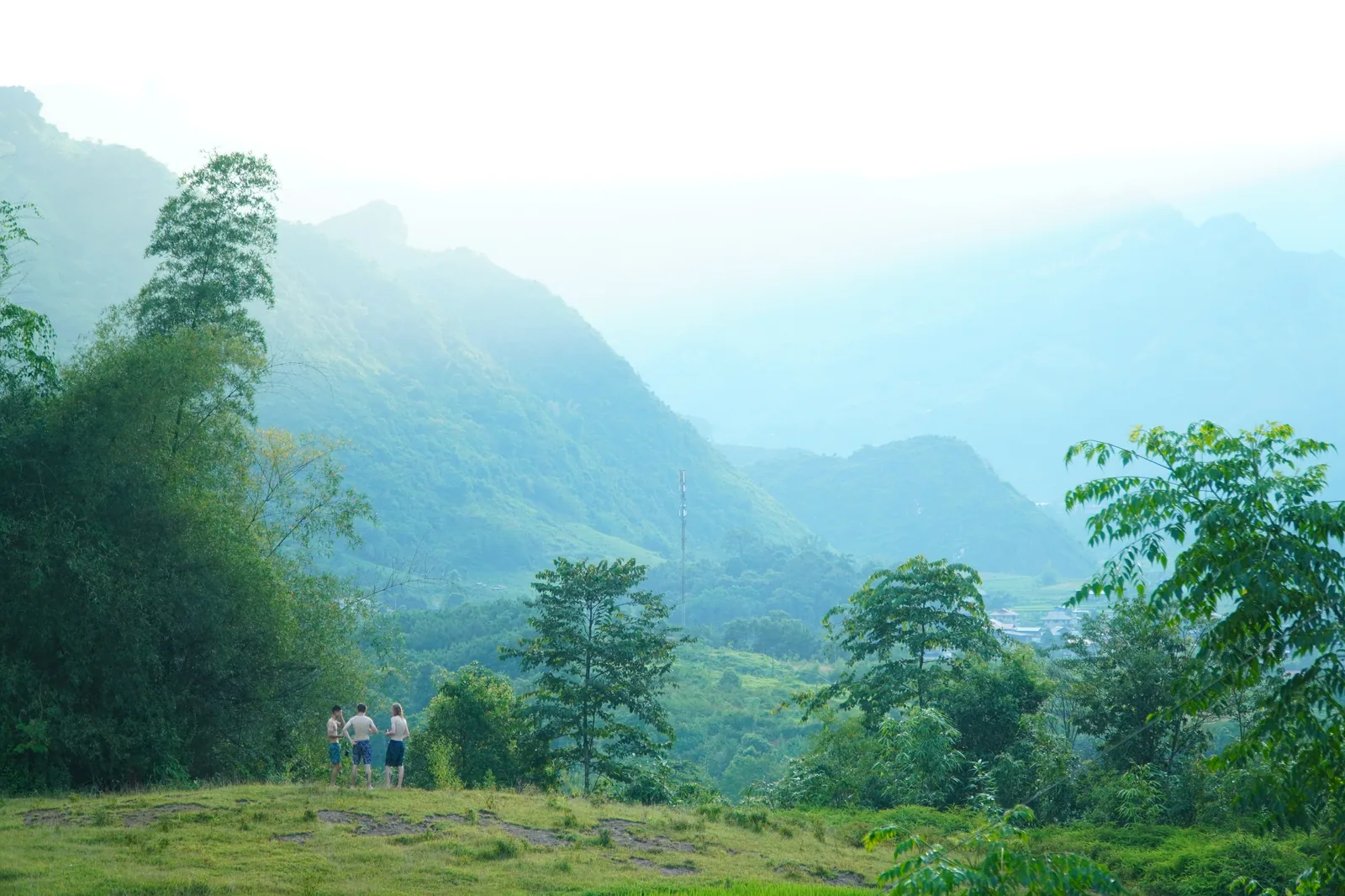 The Du Gia valley in morning haze, seen from above the village, August 2026